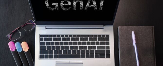 Laptop displaying GenAI, symbolizing AI’s role in modern coaching